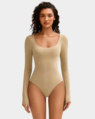 Beige scoop-neck bodysuit with long sleeves, fitted high-cut legs
