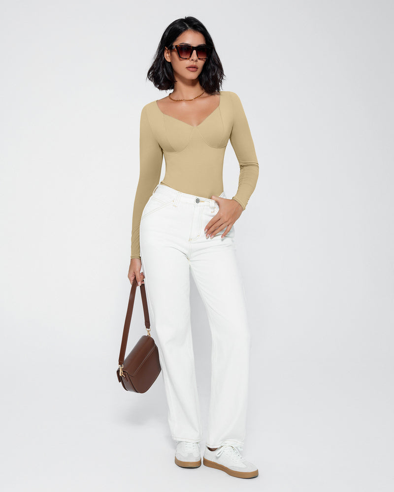 Khaki double-lined tummy control bodysuit with long sleeves and V-neck, styled with white pants.