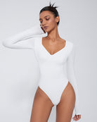 White double-lined tummy control bodysuit with long sleeves and V-neck, shaping briefs