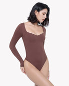 Brown sweetheart-neck double-lined bodysuit shapewear, angled side view, long sleeves
