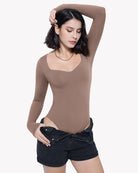Brown sweetheart-neck double-lined bodysuit shapewear, front view with raised arms