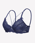 Navy lace unlined strappy bra angled view with lace cups and bow on straps