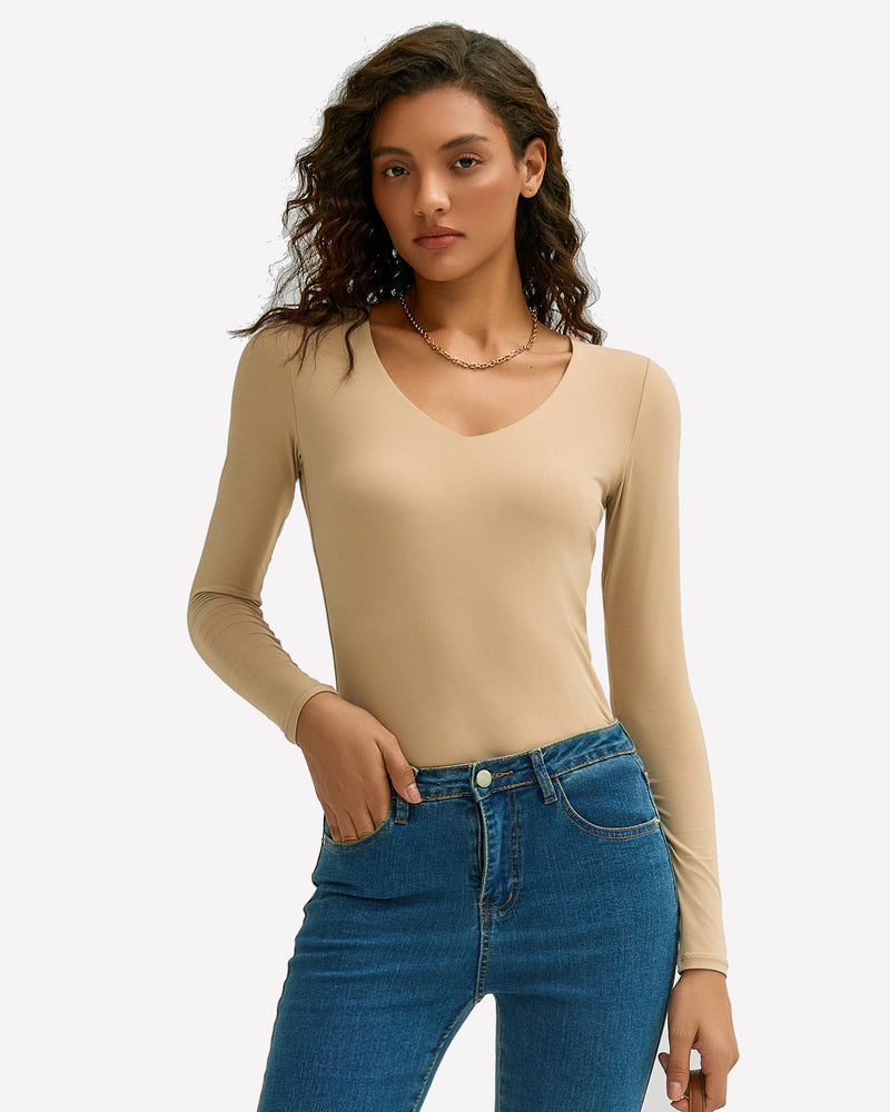 Beige long-sleeve sweetheart neck top with matching panties, styled with jeans