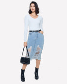 Long-sleeve sweetheart neck top, light blue, worn under a denim skirt