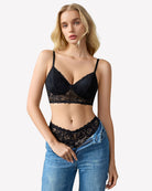 Black wireless lace bralette with scalloped lace trim and adjustable straps