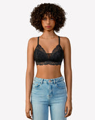 Black lace bralette, no underwire, scalloped trim and thin adjustable straps.