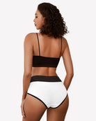 High-waist cotton hipster panties, black waistband and white briefs on model