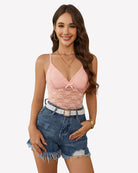Pink lace V-neck camisole crop top with adjustable spaghetti straps and bow detail
