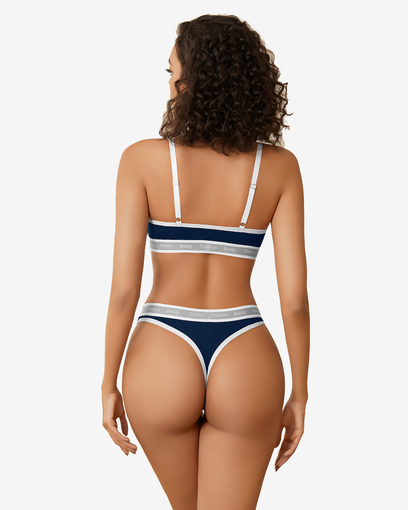 Navy blue contrast bra and panty set, back view with white trim and adjustable straps