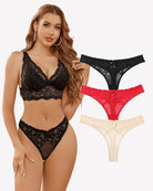 Low-waist black lace mesh thong with scalloped trim and central bow detail