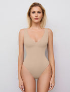 Double-lined bodysuit leotard in nude beige, deep V neck, high-cut leg openings