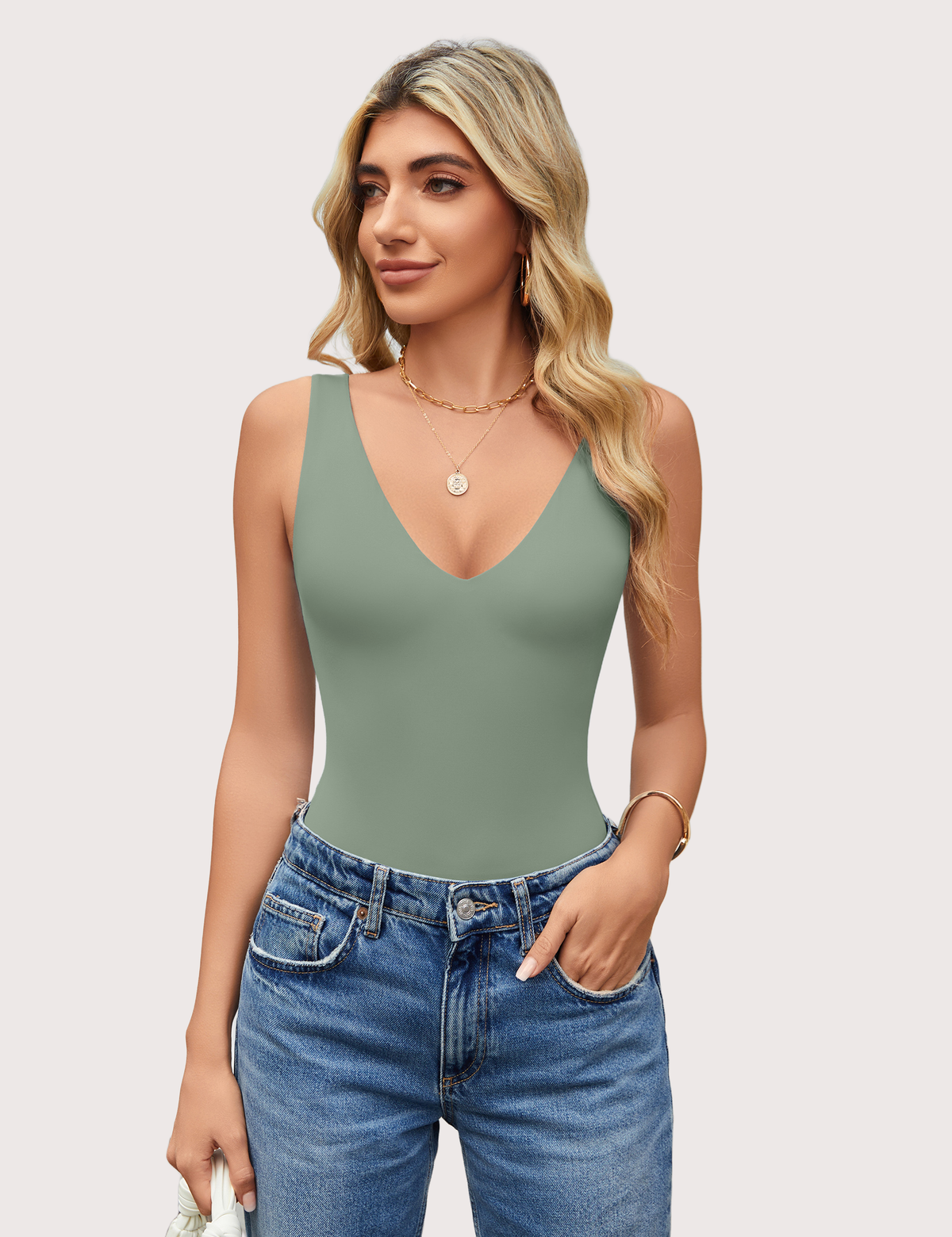 Double-lined bodysuit leotard in sage green, deep V neck, sleeveless fitted style