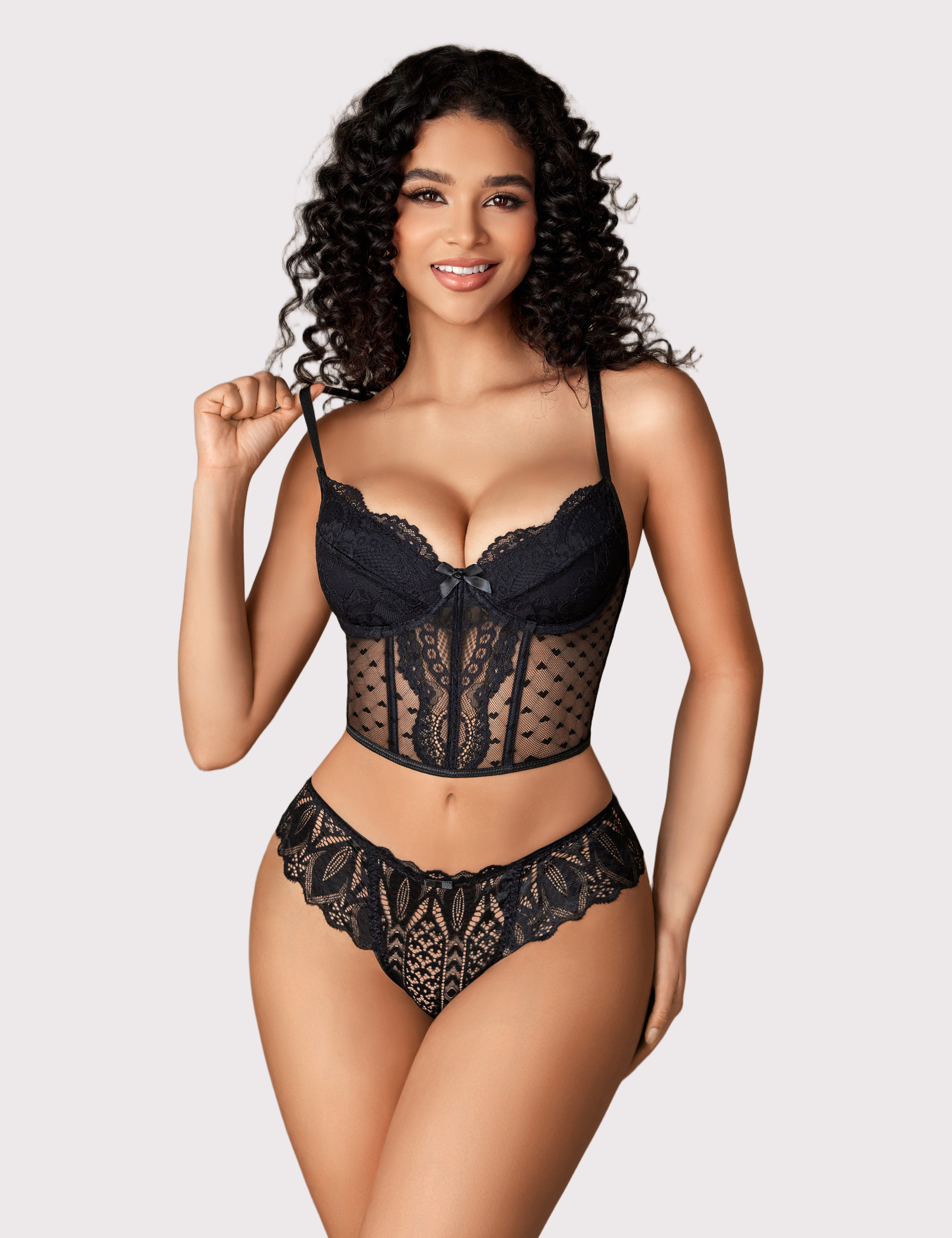 Black lace thong underwear with scalloped edges on model