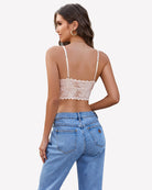 Nude lace camisole with crisscross back and scalloped lace hem