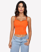 Ruched orange Y2K tank crop top with spaghetti straps and mesh-like texture