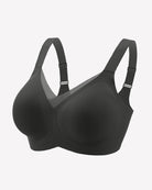 Seamless no-underwire comfort bra, black, front view with adjustable straps.