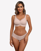Seamless no-underwire comfort bra, light nude, smooth cups and adjustable straps.