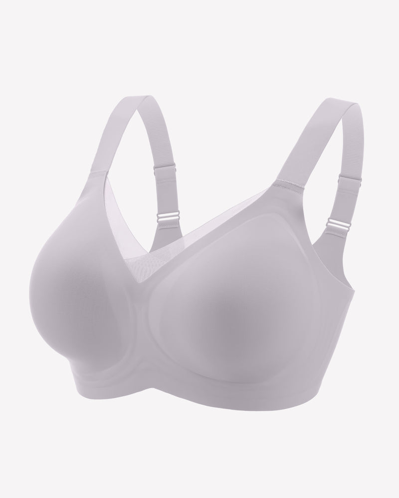 Seamless no-underwire comfort bra, pale color, smooth cups with adjustable straps.