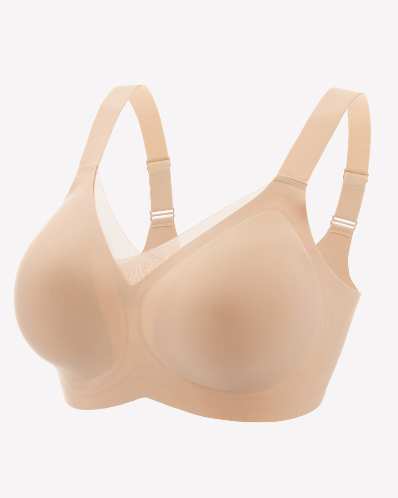 Nude beige seamless no-underwire bra with adjustable straps and smooth molded cups.