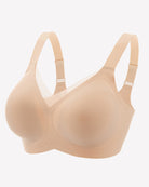 Nude beige seamless no-underwire bra with adjustable straps and smooth molded cups.