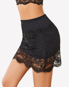 Black lace half slip skirt with scalloped lace edge hem and gathered elastic waistband.