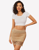 Nude lace half slip skirt with elastic waistband and scalloped hem, sheer lace overlay.