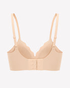 Nude seamless wireless push-up bra front with adjustable straps and hook closure