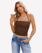 Brown halter ruched crop tank with thin straps and fitted ruched waist detail