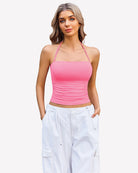 Ruched halter crop top in pink with spaghetti straps and ruched bust