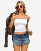 Ruched halter crop top in white with spaghetti straps and gathered bust