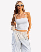 Ruched halter crop top in white with thin halter straps and ruched front
