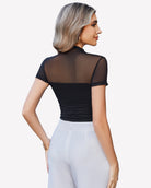 Black short-sleeve mesh bodysuit with turtle neck, ruched back silhouette.