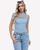 Light blue short-sleeve mesh bodysuit with turtle neck, ruched silhouette.