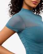 Teal blue mesh short-sleeve bodysuit with turtle neck, ruched detail.