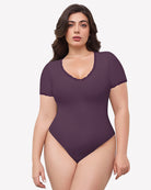 Double-lined lace V-neck bodysuit in dark plum with lace-trim neckline and sleeves