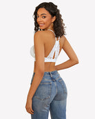 White lace racerback wireless bralette, open-back design with scalloped edges