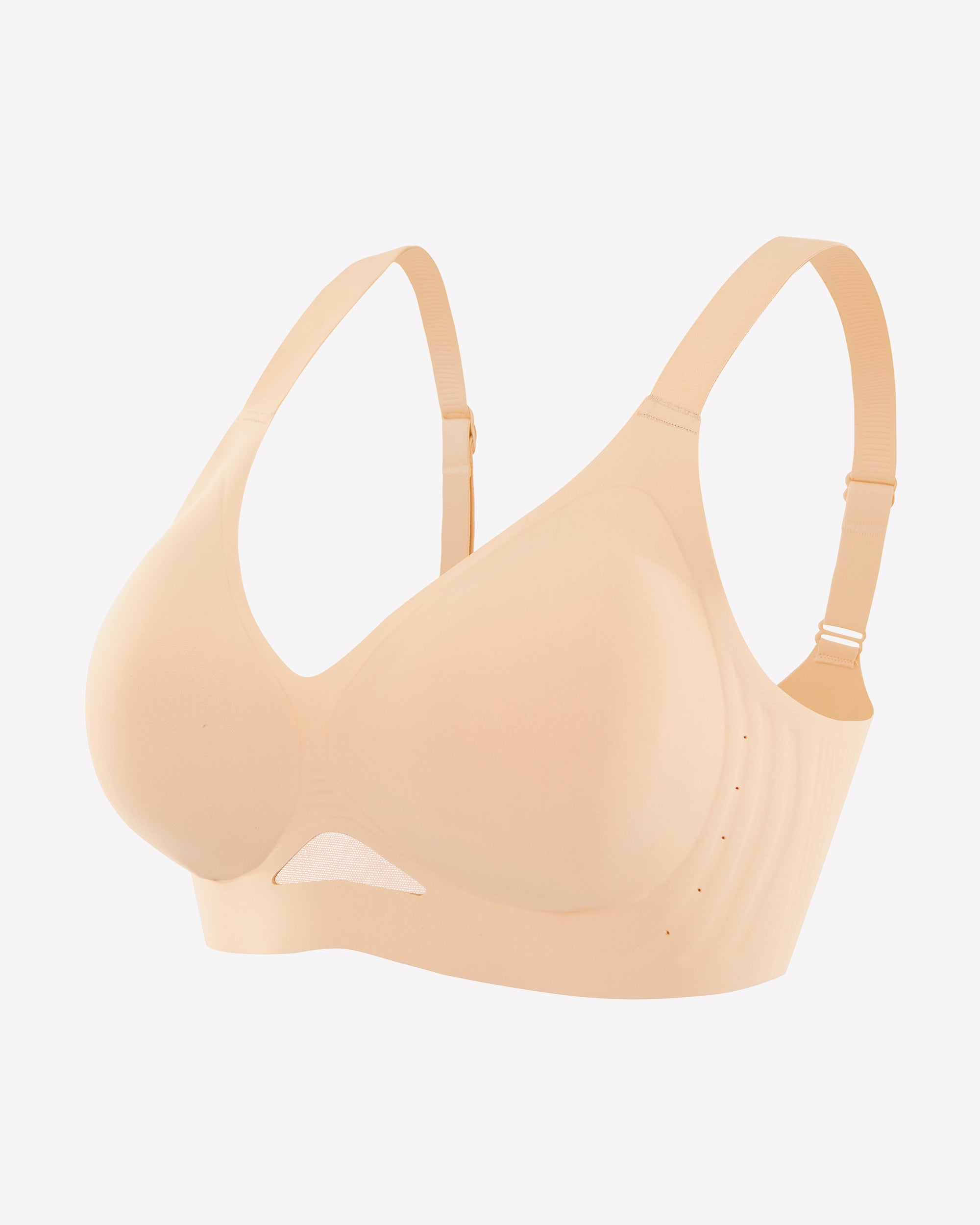 Beige seamless wireless push-up bra with molded cups and adjustable straps