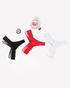 Lace thong panties assortment in black, red, and white with narrow strap