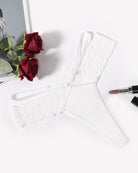 White lace V-waist thong panties with scalloped floral lace trim