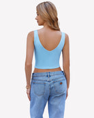 Back view of light blue crop plunge tank top with V-neck and wide straps