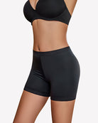 Black seamless boyshort panties with low-profile leg openings and lace trim