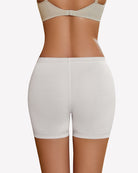 Nude seamless boyshort panties, back view, scalloped lace trim at legs