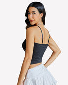Black lace-trim crop top back view with thin spaghetti straps