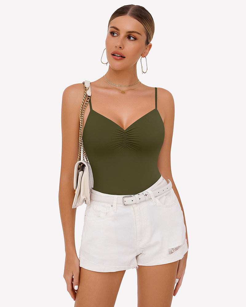 Olive green ruched V-neck thong bodysuit with thin spaghetti straps, worn under white shorts.