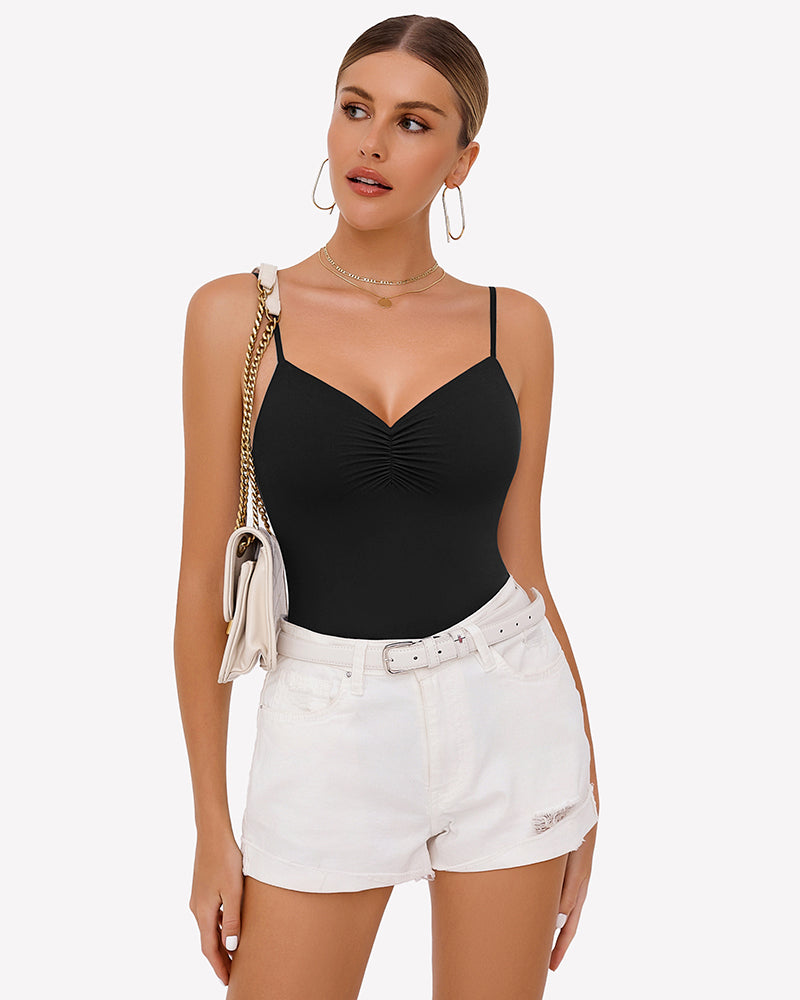 Black ruched V-neck thong bodysuit with thin spaghetti straps, worn under white shorts.
