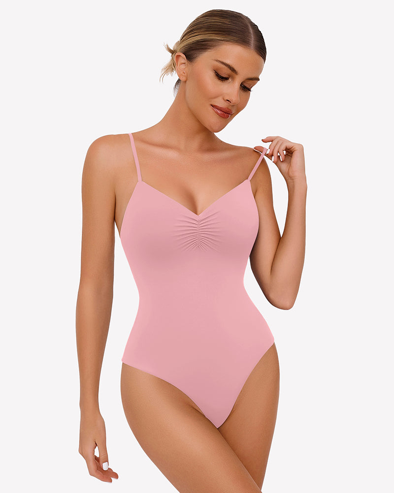 Light pink ruched V-neck thong bodysuit with thin spaghetti straps.