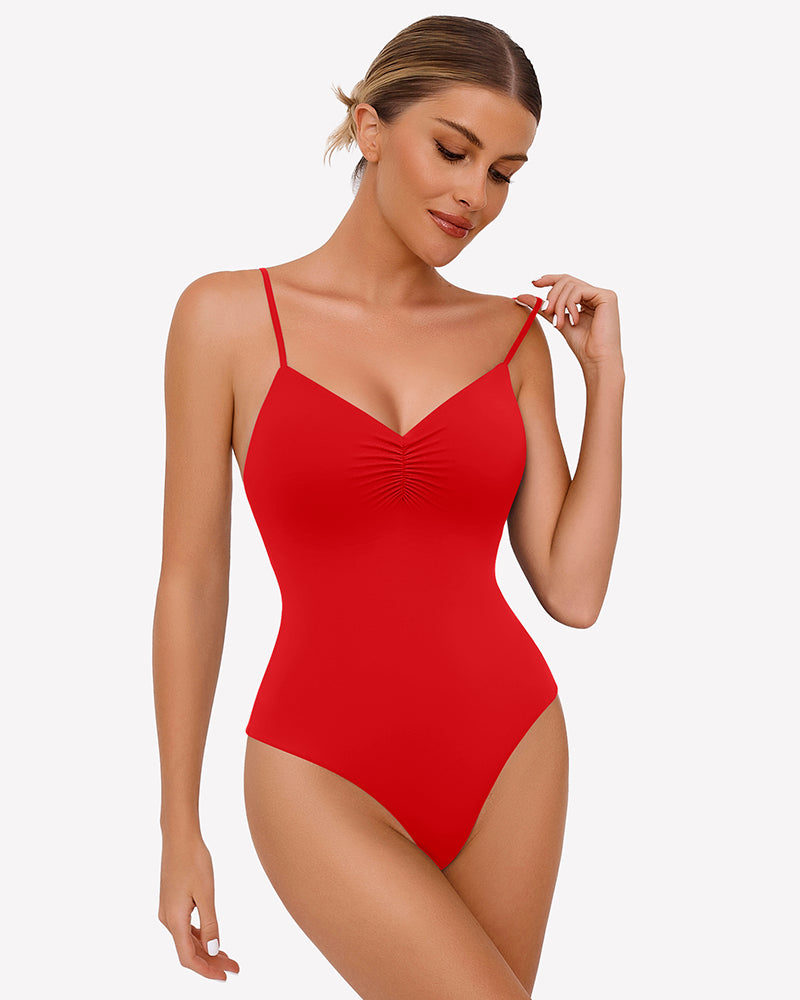 Ruched V-neck thong bodysuit in red, with spaghetti straps and gathered bust