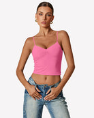 Pink ruched tank top with V neckline and thin spaghetti straps
