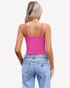 Women’s twist-front crop tank top with spaghetti straps, bright pink color, open back view