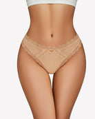 Beige low rise lace thong with satin bow center and scalloped lace trim